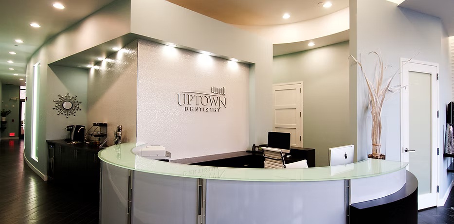 Uptown Dentistry reception desk, Park Ridge dental office interior with modern design and welcoming front desk area 